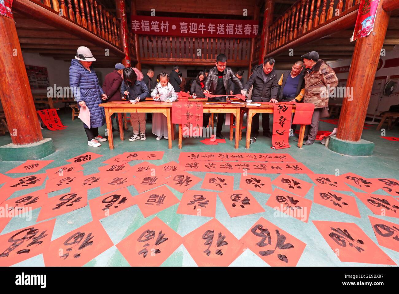 Fuzhou, China. 03rd Feb, 2021. The members of the calligraphers' association write the spring festival scrolls and Fu for villagers in Fuzhou, Jiangxi, China on 03th February, 2021.(Photo by TPG/cnsphotos) Credit: TopPhoto/Alamy Live News Stock Photo