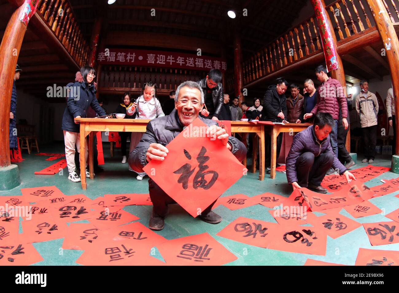 Fuzhou, China. 03rd Feb, 2021. The members of the calligraphers' association write the spring festival scrolls and Fu for villagers in Fuzhou, Jiangxi, China on 03th February, 2021.(Photo by TPG/cnsphotos) Credit: TopPhoto/Alamy Live News Stock Photo