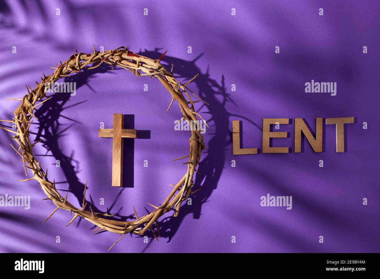 Lent season, Holy week and Good friday concept. Crown of torns and cross on purple  background Stock Photo - Alamy