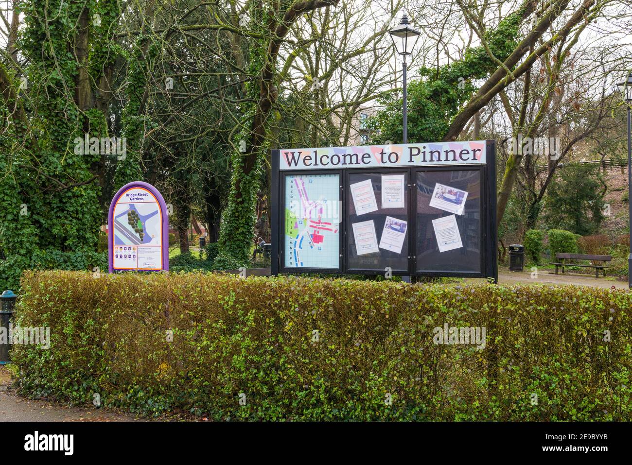 Pinner town community notice board at Bridge Street Gardens, a small