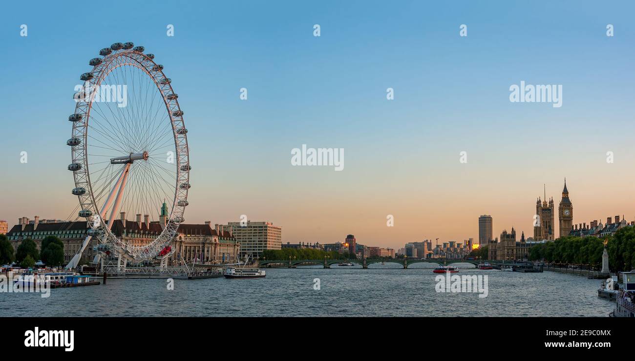 LONDON, UK - SEPTEMBER 12, 2009:  Panorama view along the River Thames from the Golden Jubilee footbridge toward The London Eye, Big Ben and the House Stock Photo