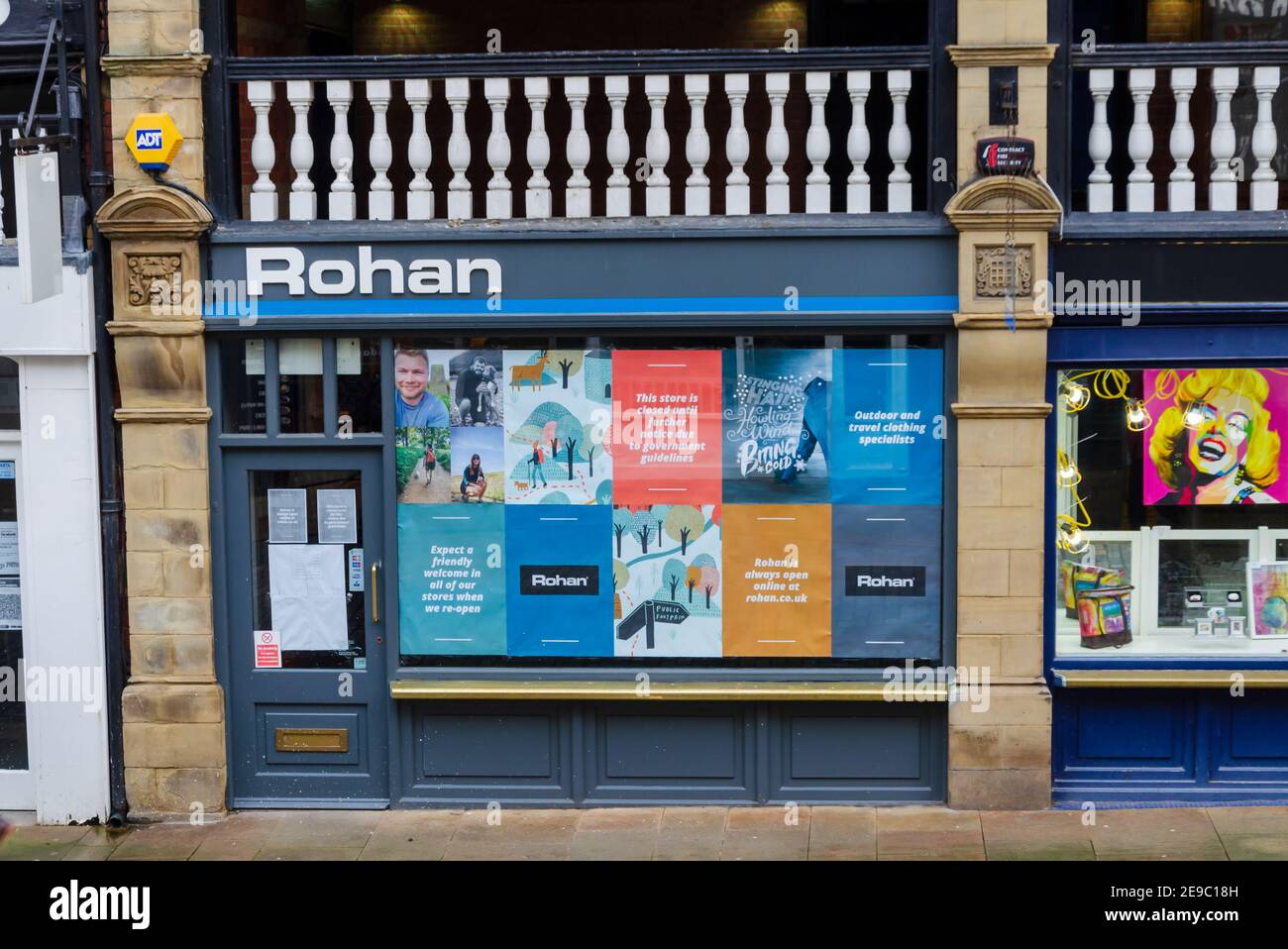 Chester; UK: Jan 29, 2021: Rohan shop is temporarily closed due to the lockdown during the corona virus pandemic. A notice in their window states that Stock Photo