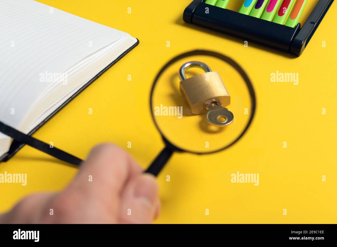 Magnifying Key creative search, research of questions concept. hand holding magnifier ...