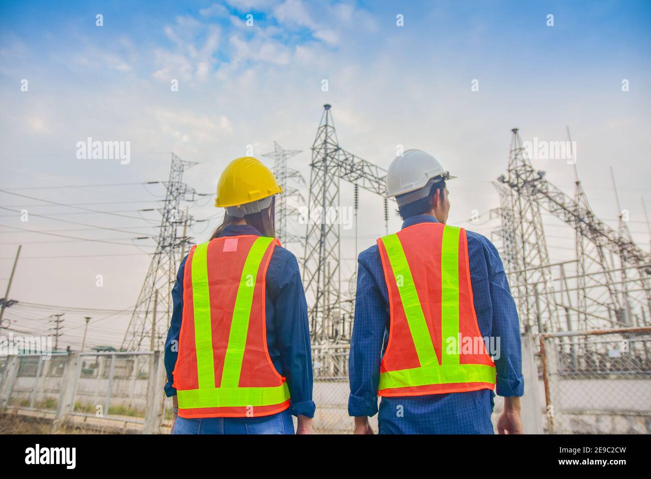 Asian Engineer Man and Women working on site power plant electric