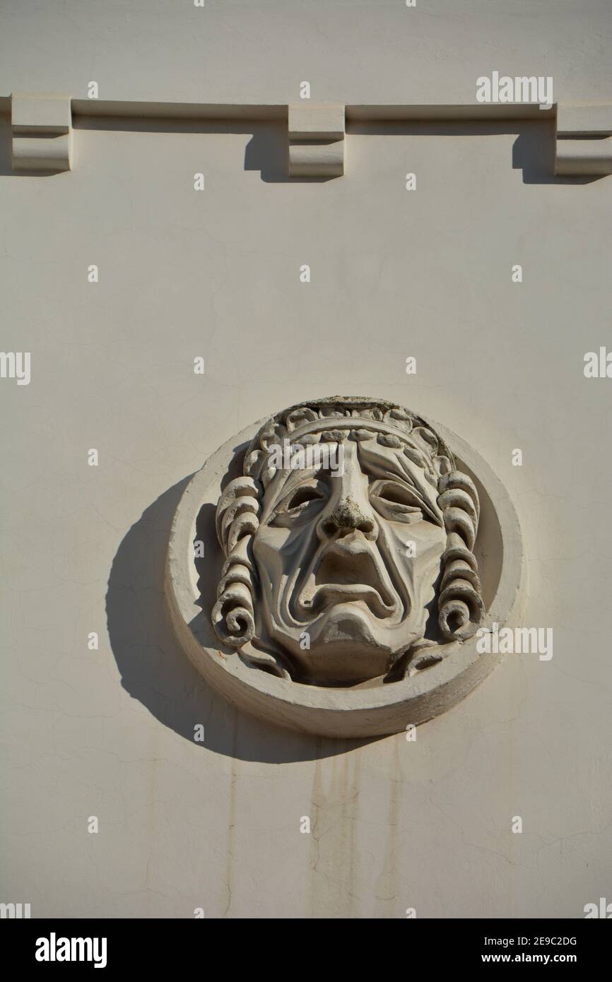 Plaster mask on wall of the theater Stock Photo