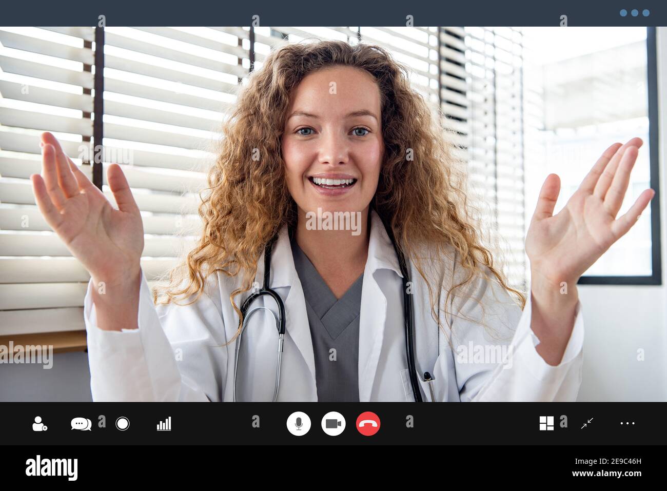 Young Caucasian woman doctor explaining patient via video call, home medical online consulation service concepts Stock Photo