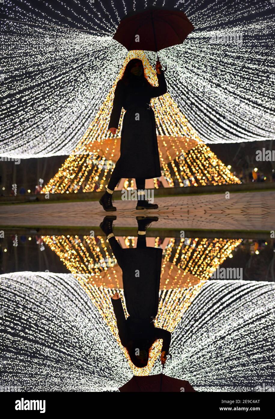 Reflexion Of Woman With Umbrella In Winter Park Stock Photo Alamy
