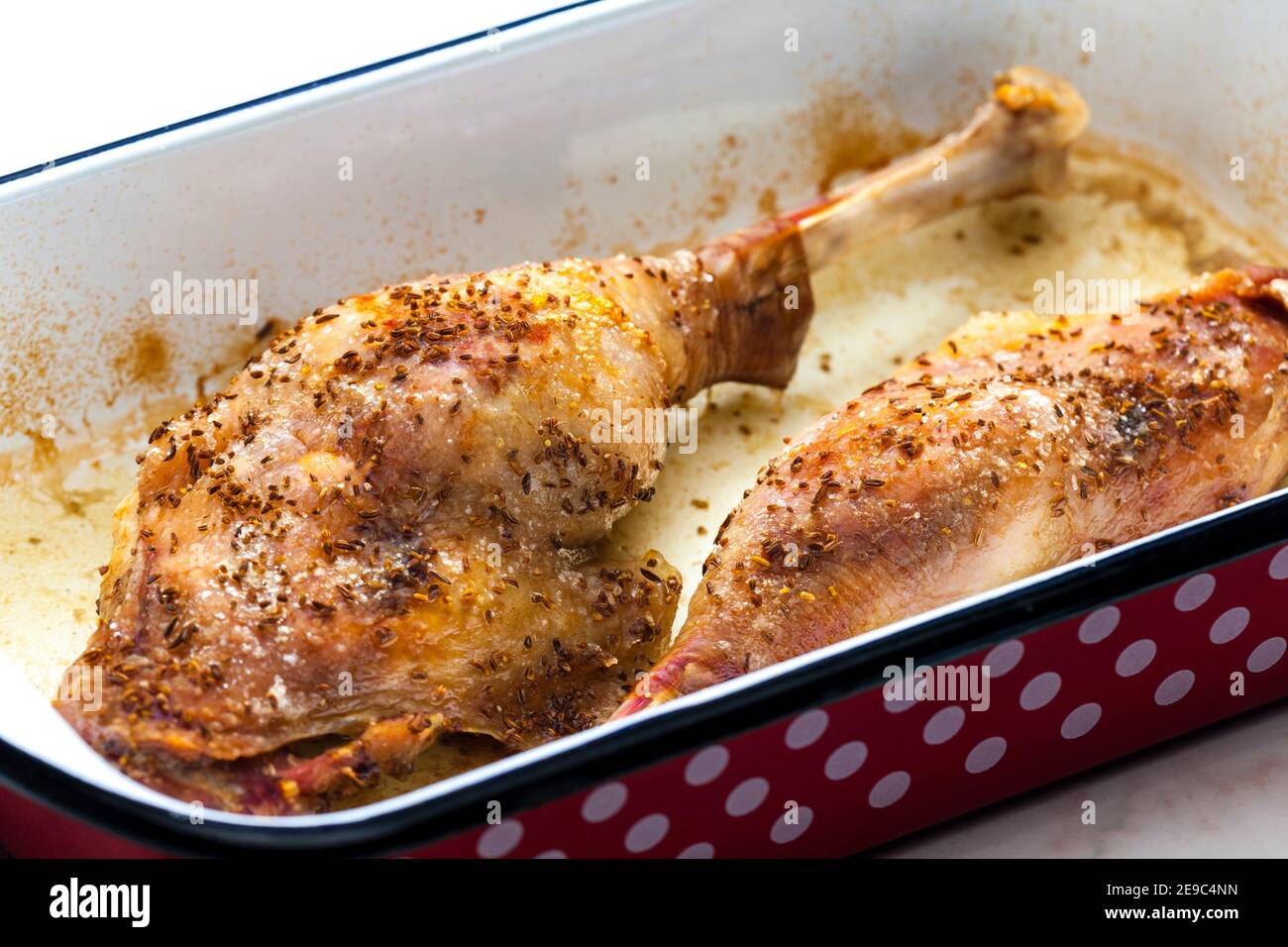 baked goose legs with cumin in frying pan Stock Photo Alamy