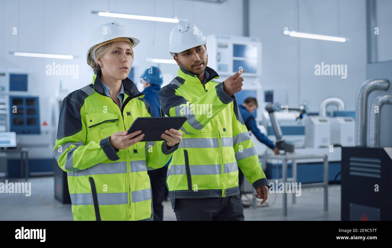 Chief Engineer and Project Supervisor in Safety Vests and Hard Hats
