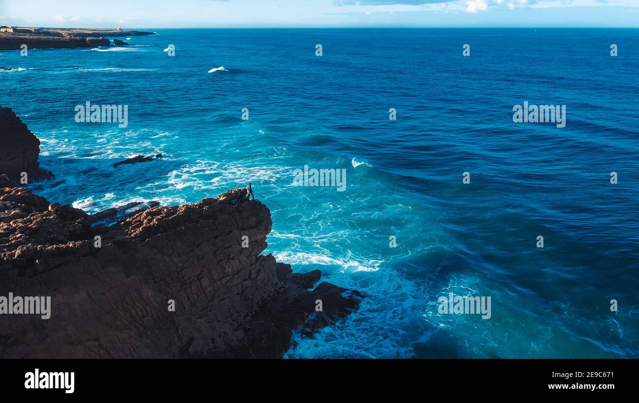 Aerial Drone Shot: Portuguese Rocky Shore with Beautiful Ocean View. Flying Over Portugal, Coastline with Oceanic Waves Rolling, Crashing into Cliffs Stock Photo
