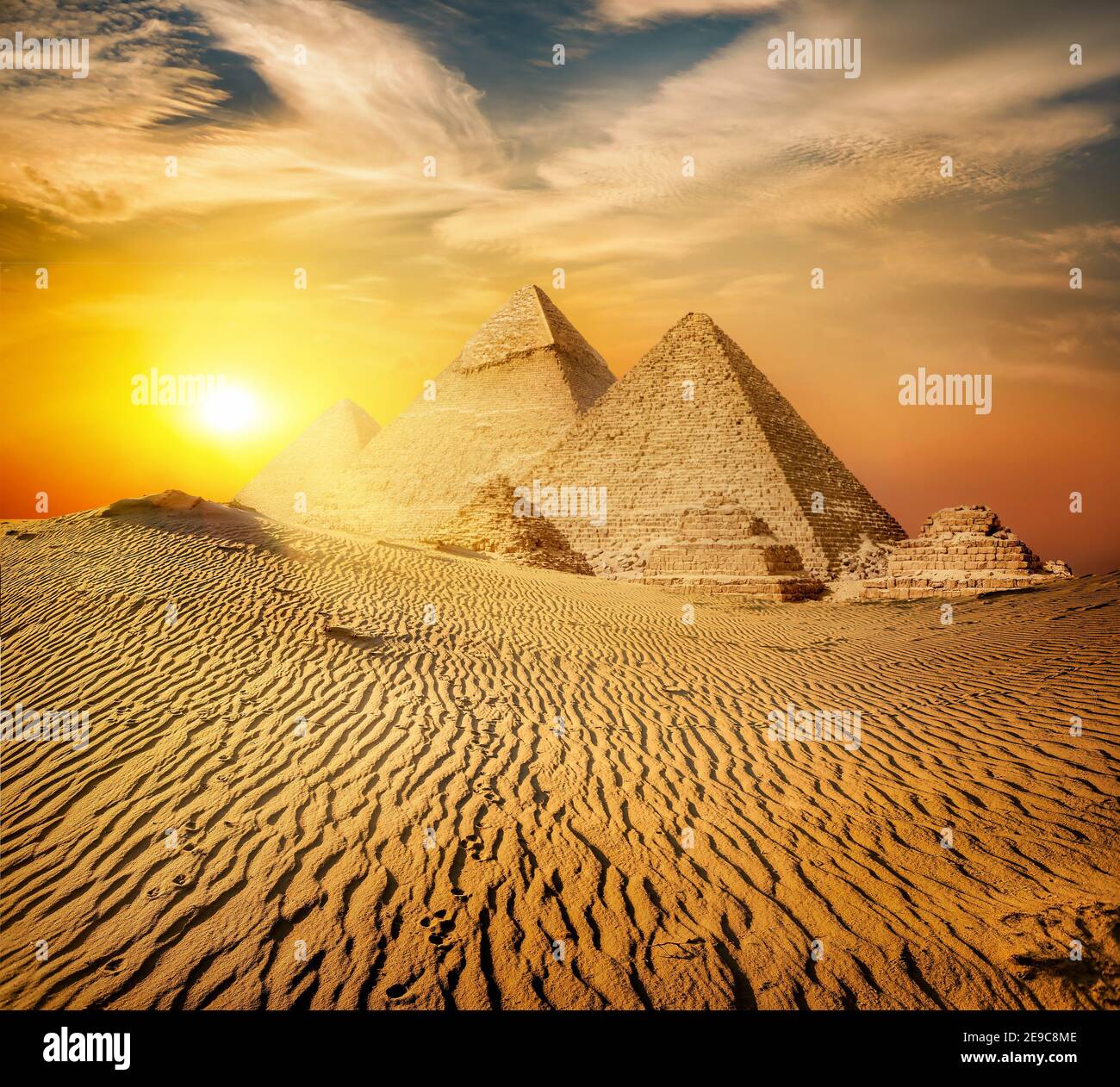 Egyptian pyramid in sand desert and clear sky. Stock Photo