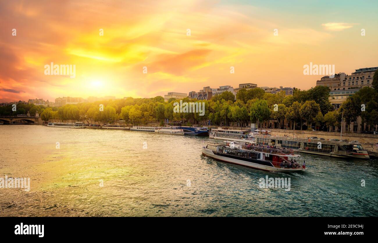 Sunset over the Seine River in Paris. Stock Photo