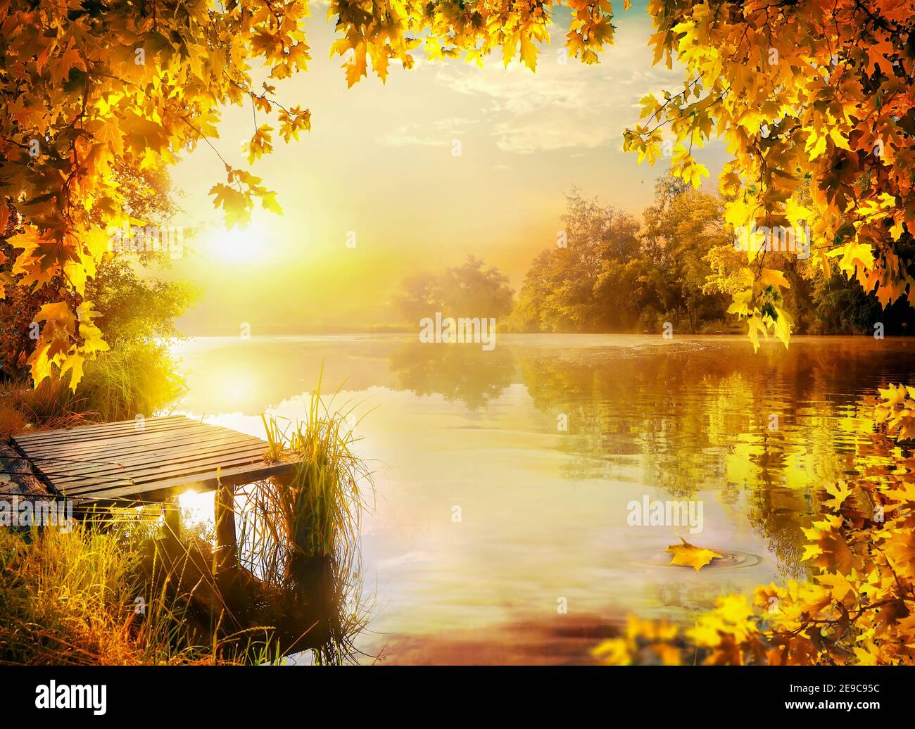 Wooden pier by the river in autumn. Stock Photo