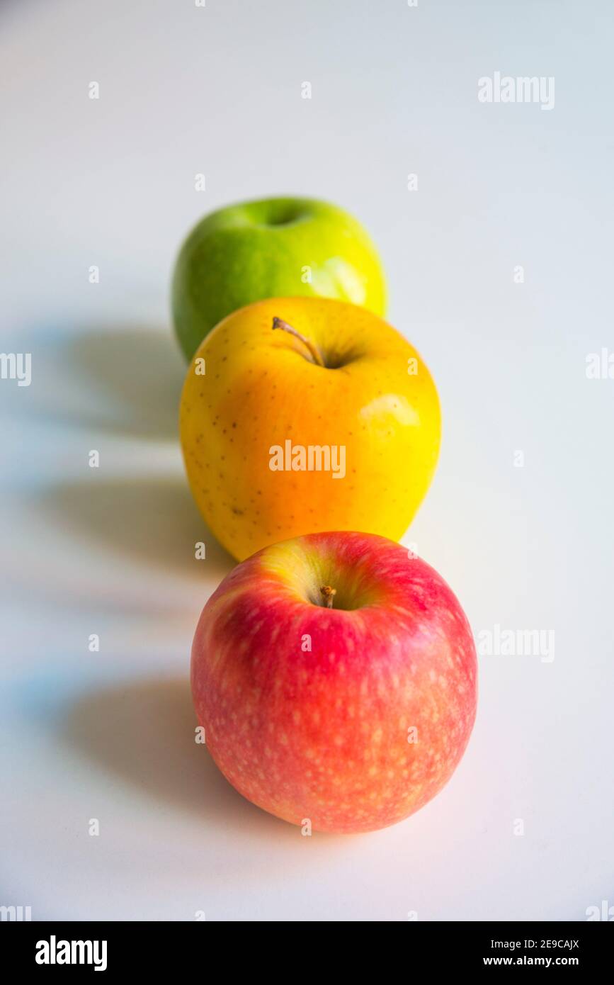 Three apples in a row. Stock Photo
