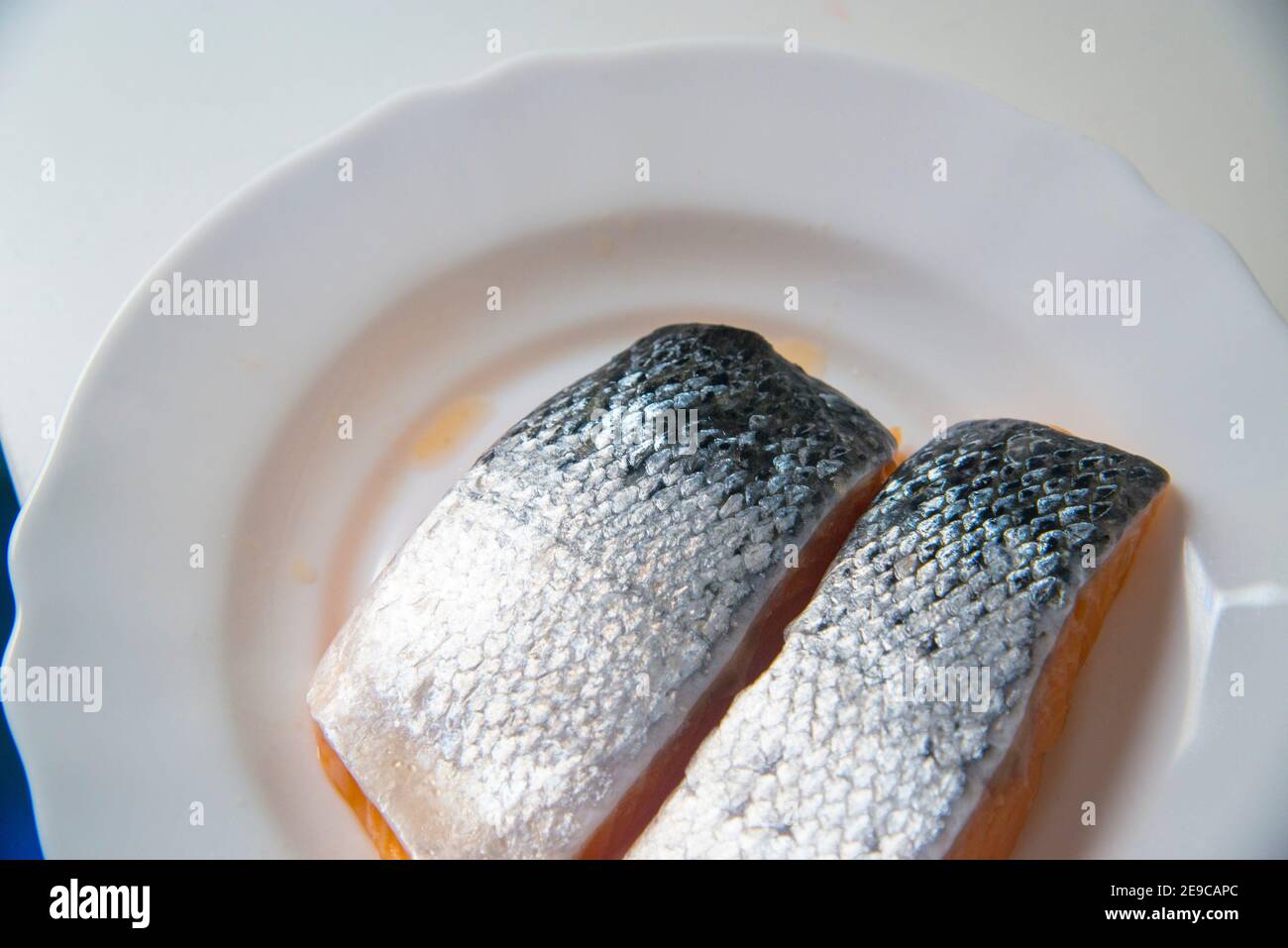 Salmon loins in a dish Stock Photo Alamy