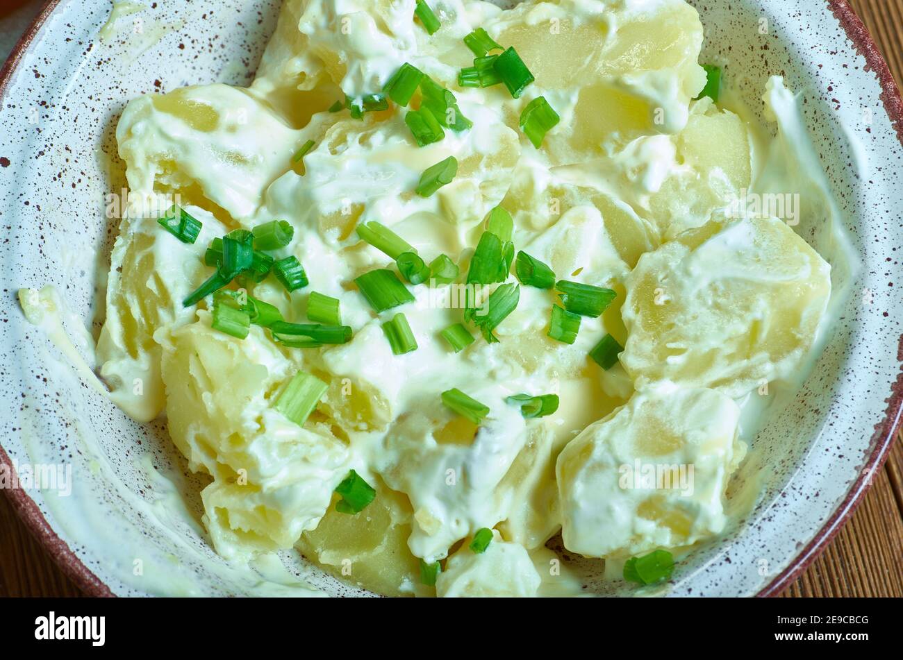 Irish Potato Salad, Cut and steam the potatoes until tender Stock Photo