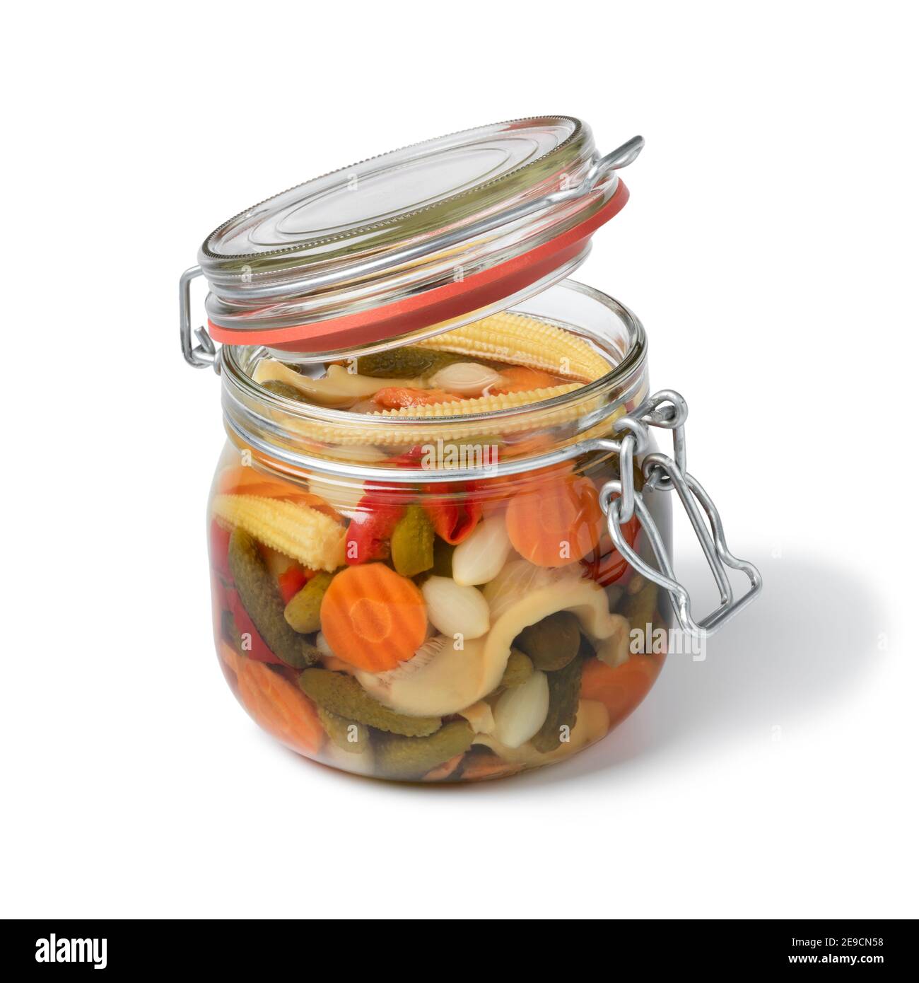 Glass jar with colorful homemade pickled vegetable mix isolated on white background Stock Photo