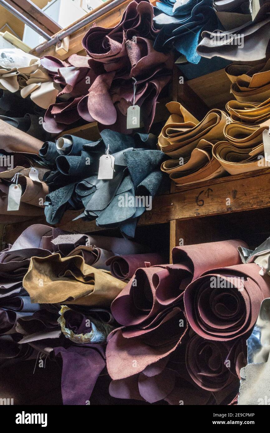 Inside the shoe factory of NPS Ltd, a British shoe maker, Wollaston, Northamptonshire, UK; pre-production rolls of leather Stock Photo