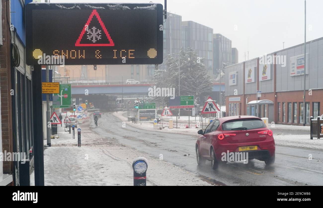 flashing warning sign of snow and ice leeds city centre united kingdom Stock Photo