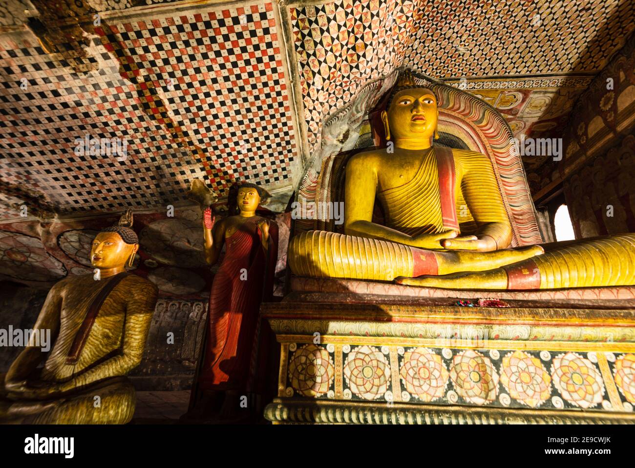 Buddha statues in Dambulla Royal Cave Temple and Golden Temple. Ancient craved rock statues, buddhist art. Famous religious place in Sri Lanka Stock Photo