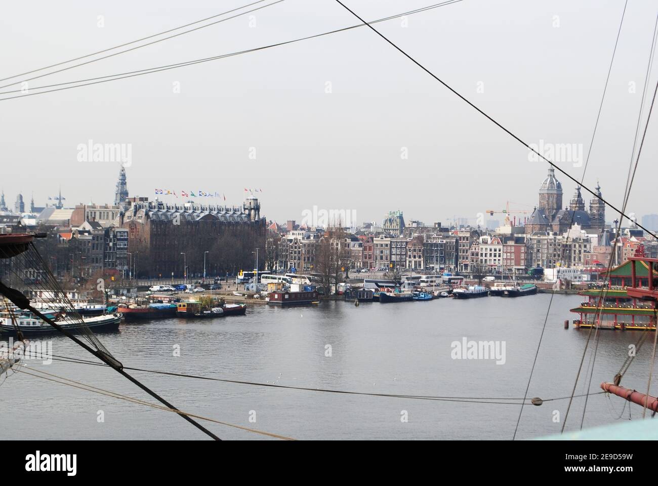 The view of some of Amsterdam's famous landmarks including the Basilica of Saint Nicholas. Stock Photo