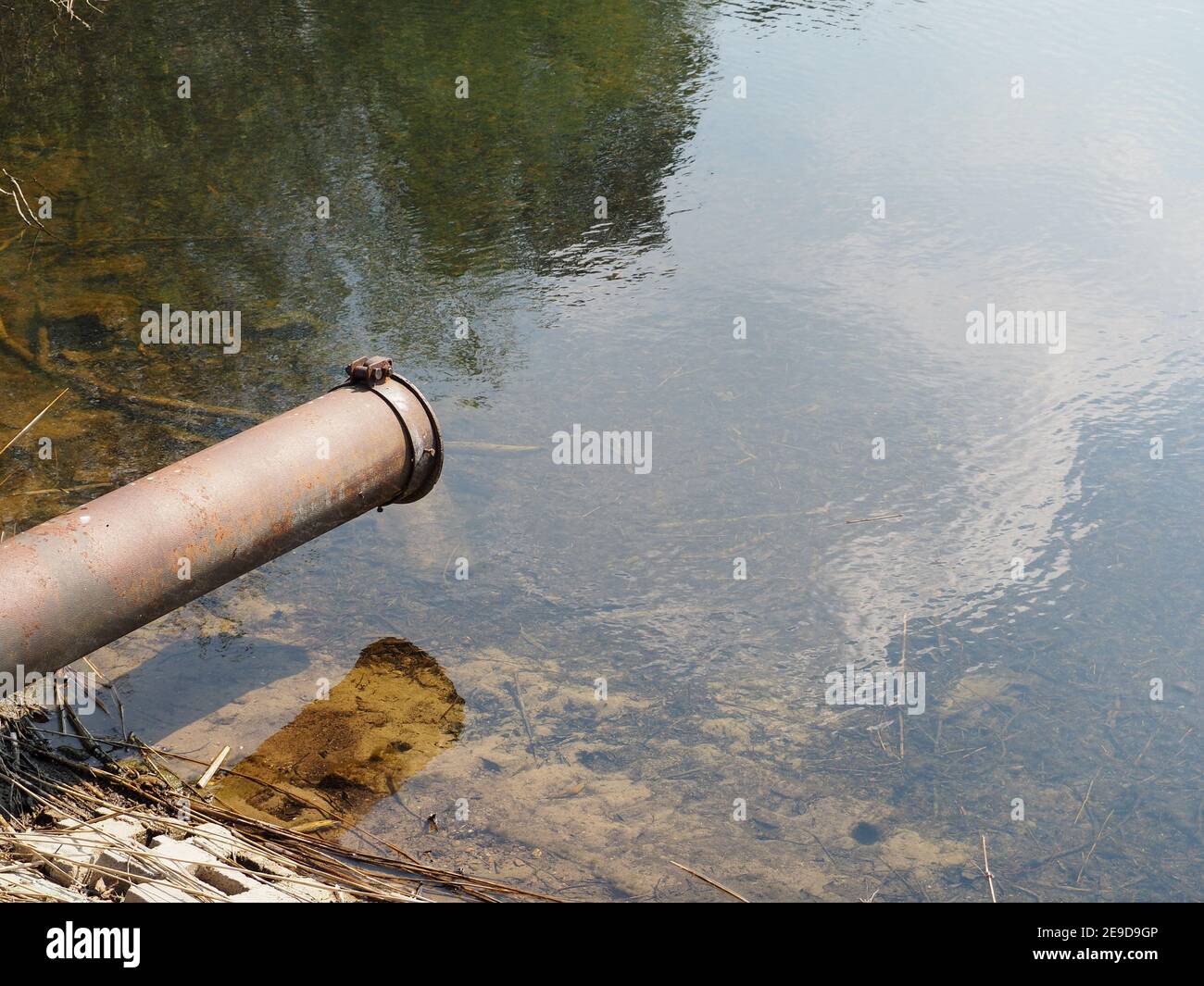 View of a pipeline into the river Stock Photo - Alamy