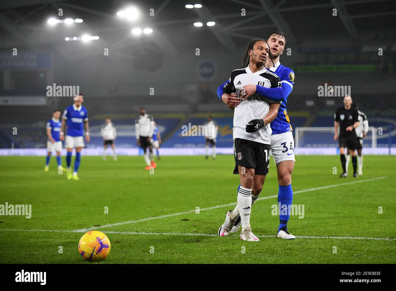 Bobby Reid of Fulham and Joel Veltman of Brighton & Hove Albion - Brighton & Hove Albion v Fulham, Premier League, Amex Stadium, Brighton, UK - 27th January 2021  Editorial Use Only - DataCo restrictions apply Stock Photo