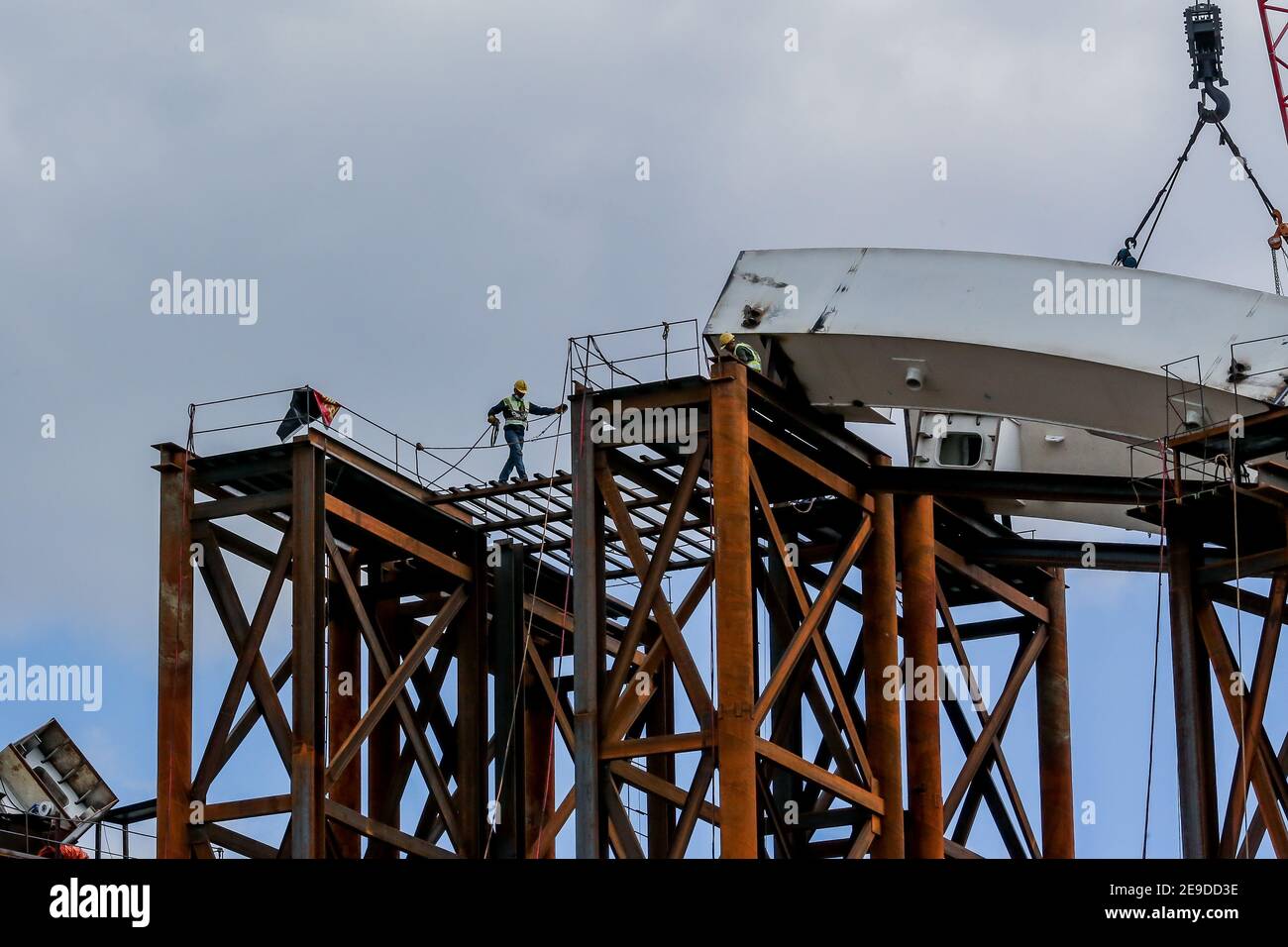 Manila, Philippines. 4th Feb, 2021. A construction worker is seen at the building site of the Binondo-Intramuros Bridge in Manila, the Philippines, Feb. 4, 2021. The construction of the China-funded bridge started in July of 2018. Credit: Rouelle Umali/Xinhua/Alamy Live News Stock Photo