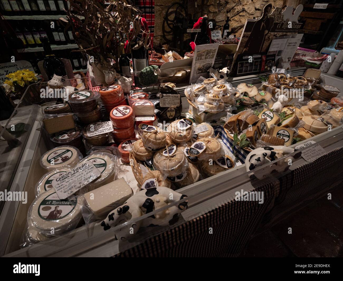 A display of foods cheeses and truffles in a delicatessen in a shop in the Spamish hill town of