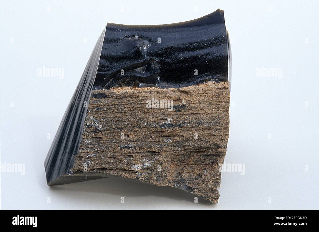 Obsidian is a volcanic glass. Sample. Stock Photo