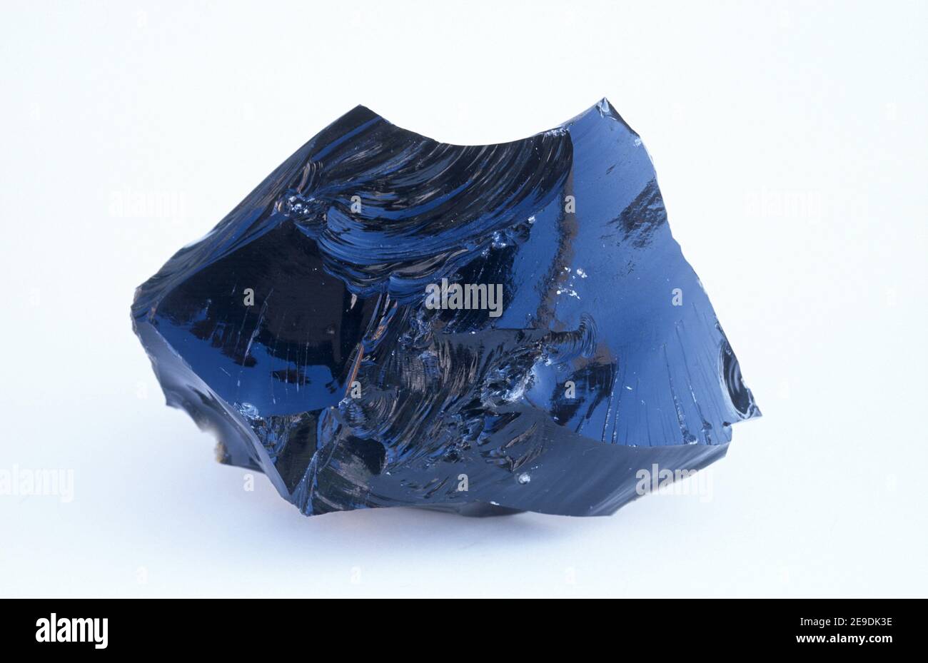 Obsidian (volcanic glass) showing conchoidal fracture. Sample Stock