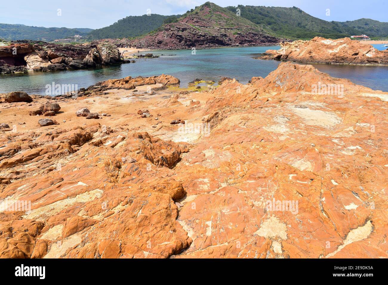 Quartz-keratophyre is a hard subvolcanic rock. Cala Pregonda, Menorca, Balearic Islands, Spain. Stock Photo