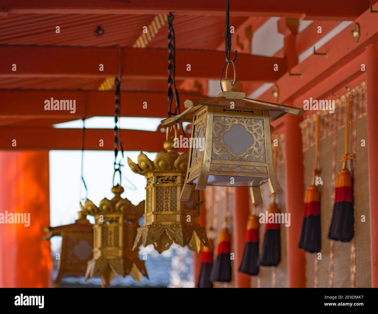 Selective focus of a lamp hanging from the ceiling on a Chinese temple