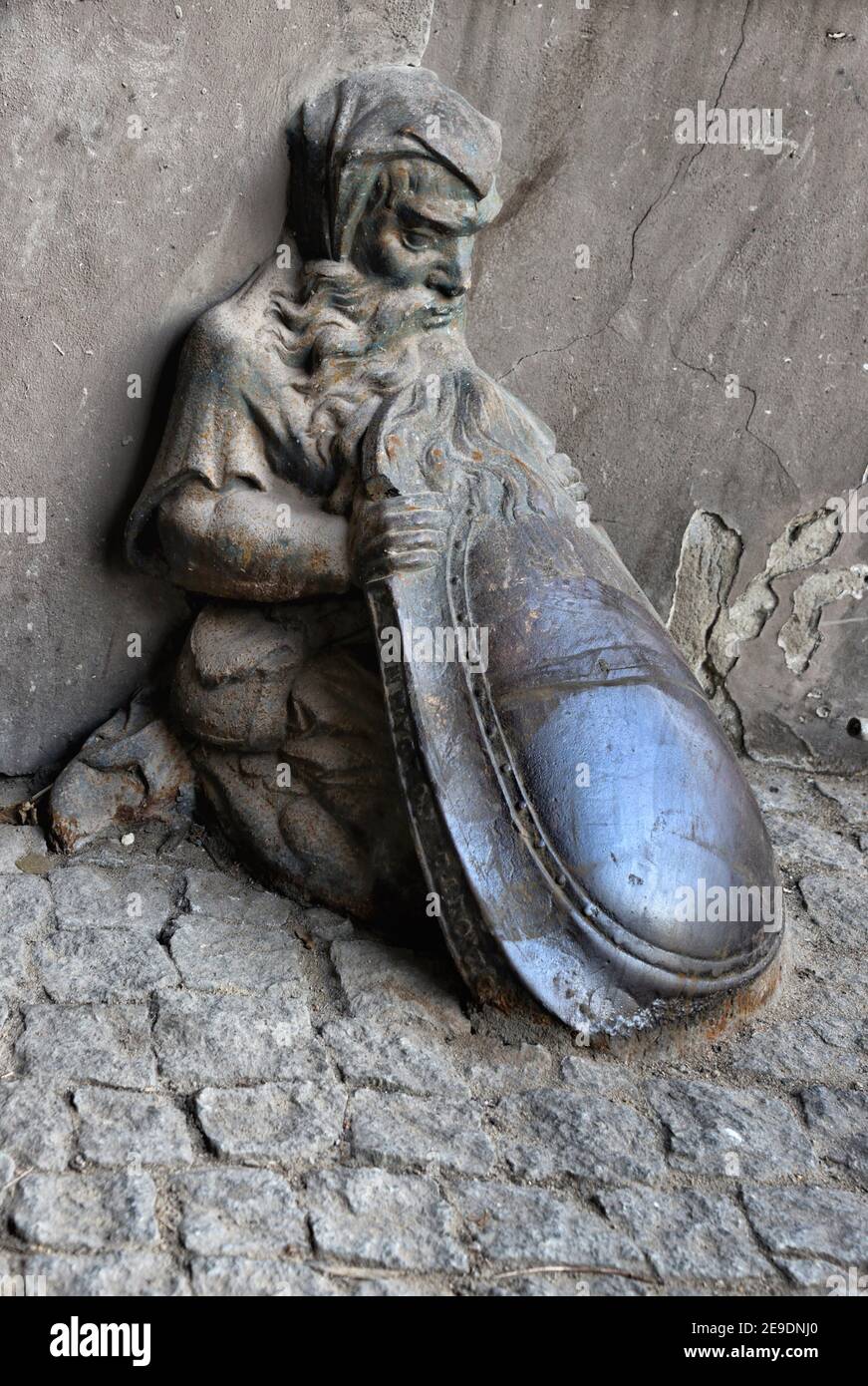 Historic architectural detail, cast iron statue being protection