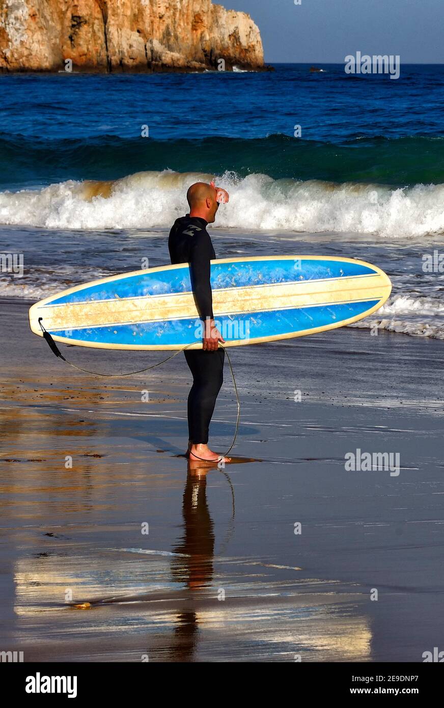 Europe, Portugal, Southern Portugal , Algarve region , Faro district , Sagres, Mareta beach - Praia da Mareta , single male surfer with surfboard Stock Photo