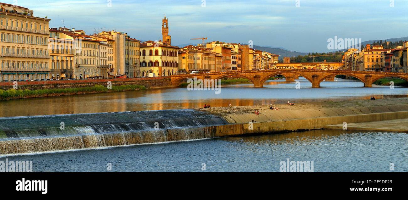 Europe, Italy, Tuscany, Florence, scenery of old town at sunset, buildings along Arno river Stock Photo
