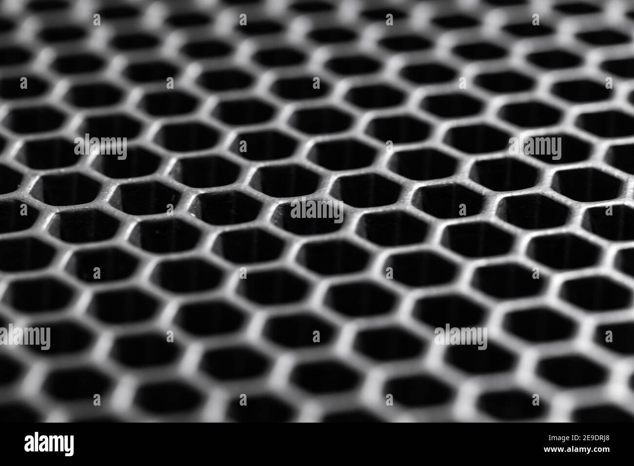 Black honeycomb membrane structure, macro photo with selective soft focus. Hight-tech background texture Stock Photo
