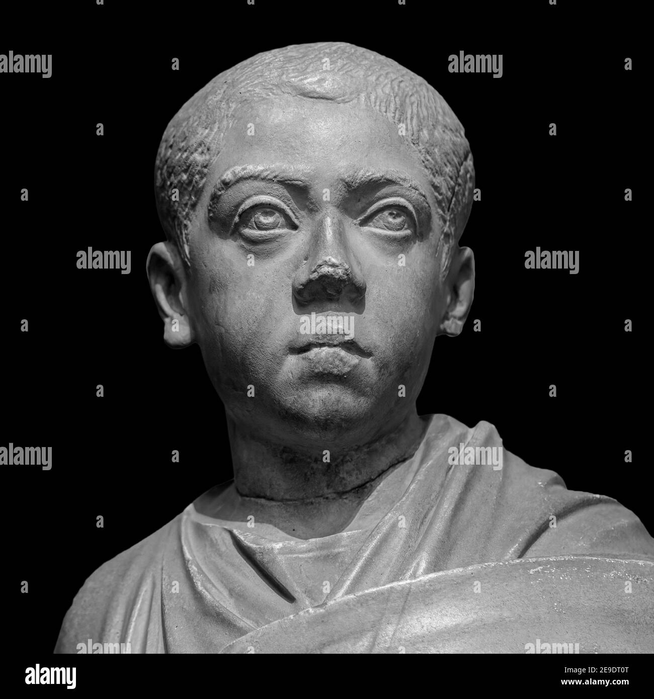 Ancient roman marble portrait of a boy. Young man head statue isolated