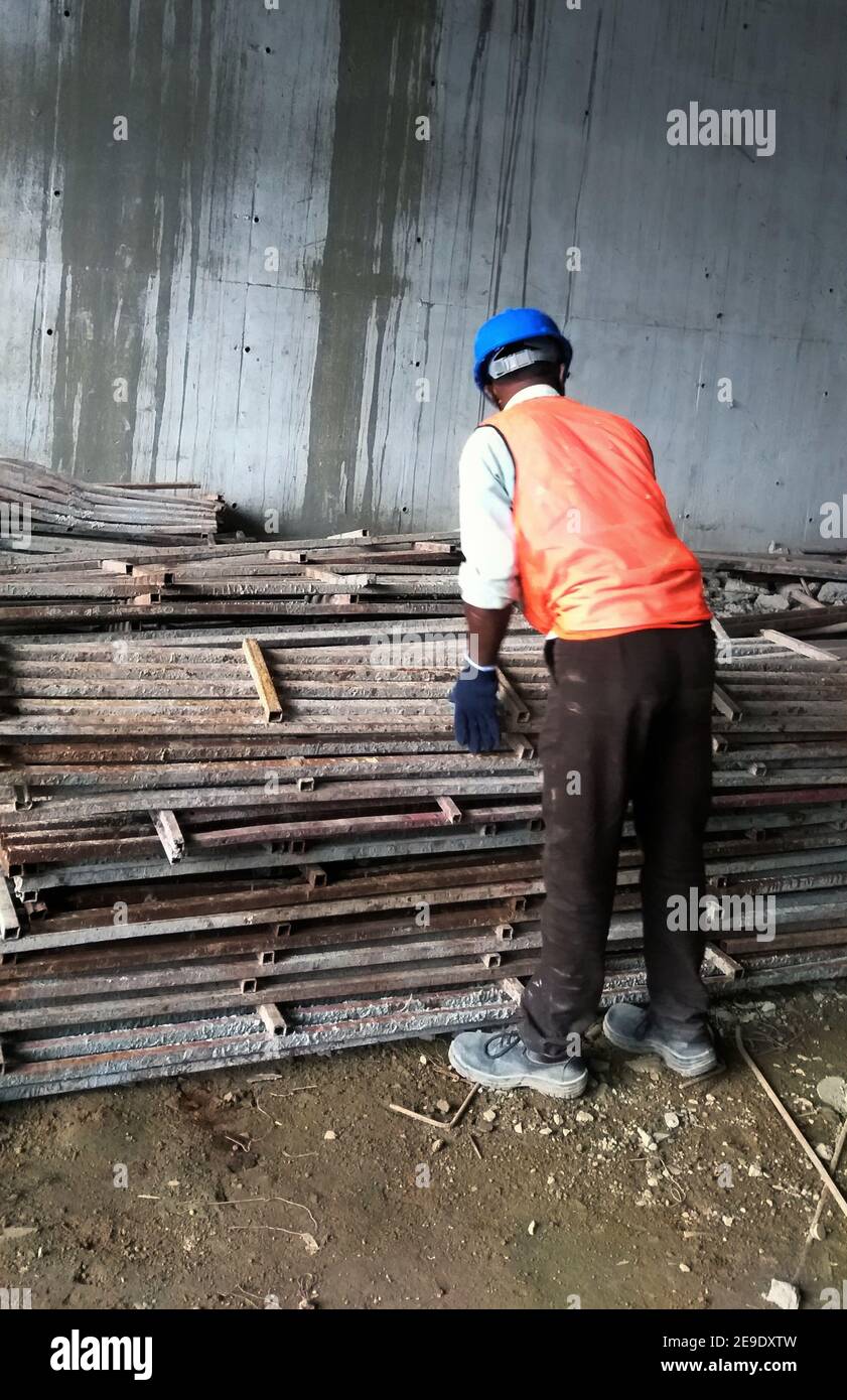 KOLKATA, INDIA Jan 01, 2021 workers are stacking construction
