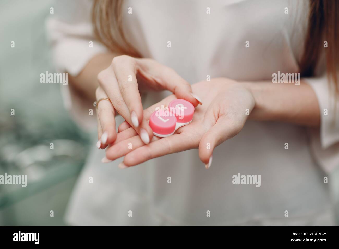 Box container for contact lenses woman hands holding case for lens