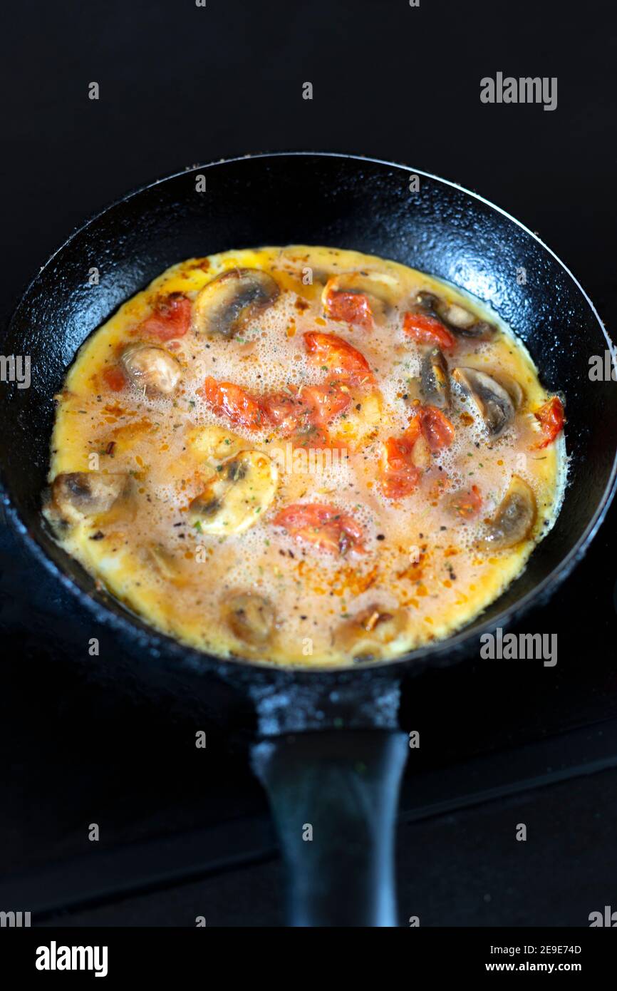 Spanish omelette in a small frying pan Stock Photo Alamy