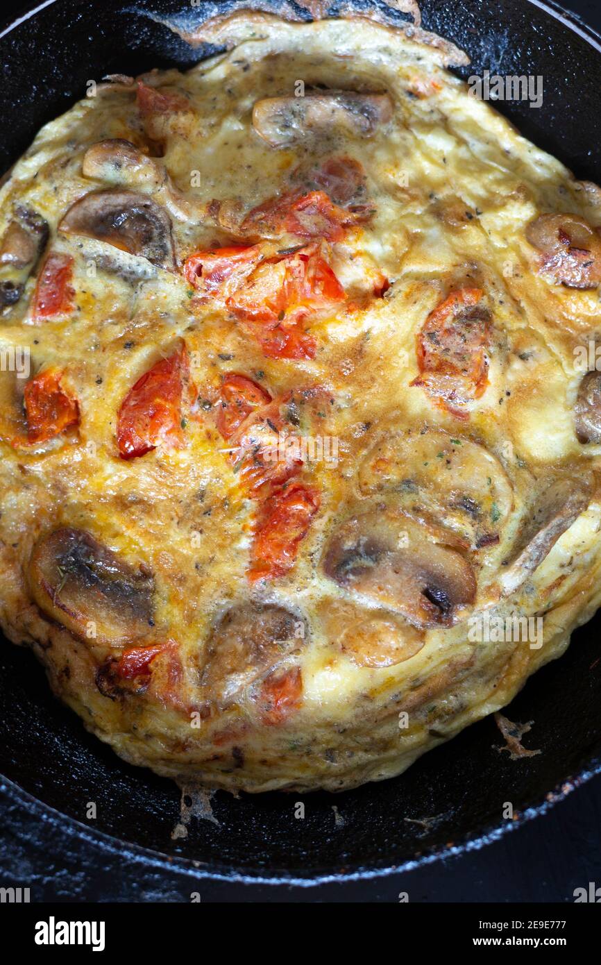 Spanish omelette in a small frying pan Stock Photo Alamy