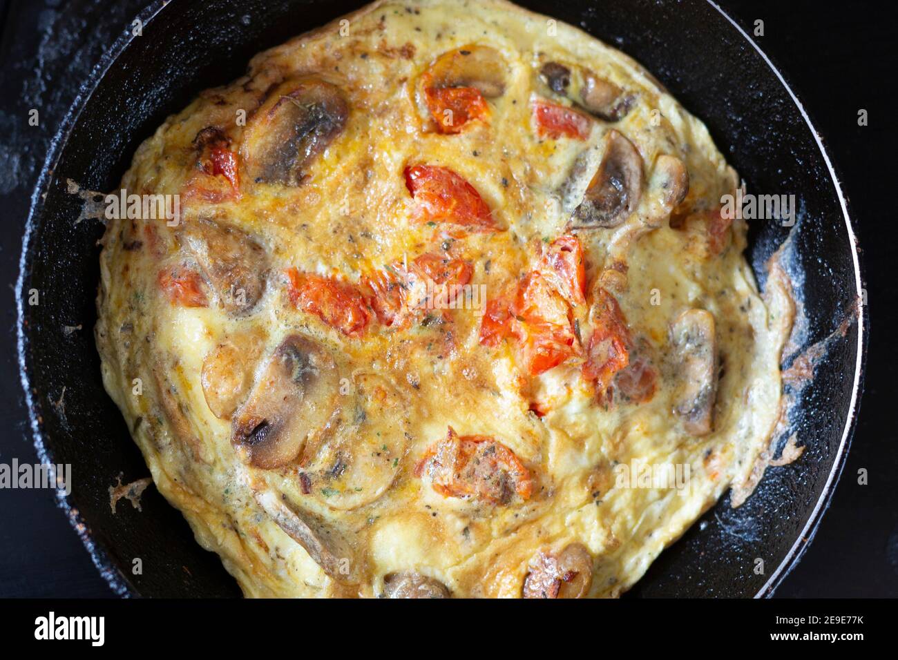Spanish omelette in a small frying pan Stock Photo Alamy