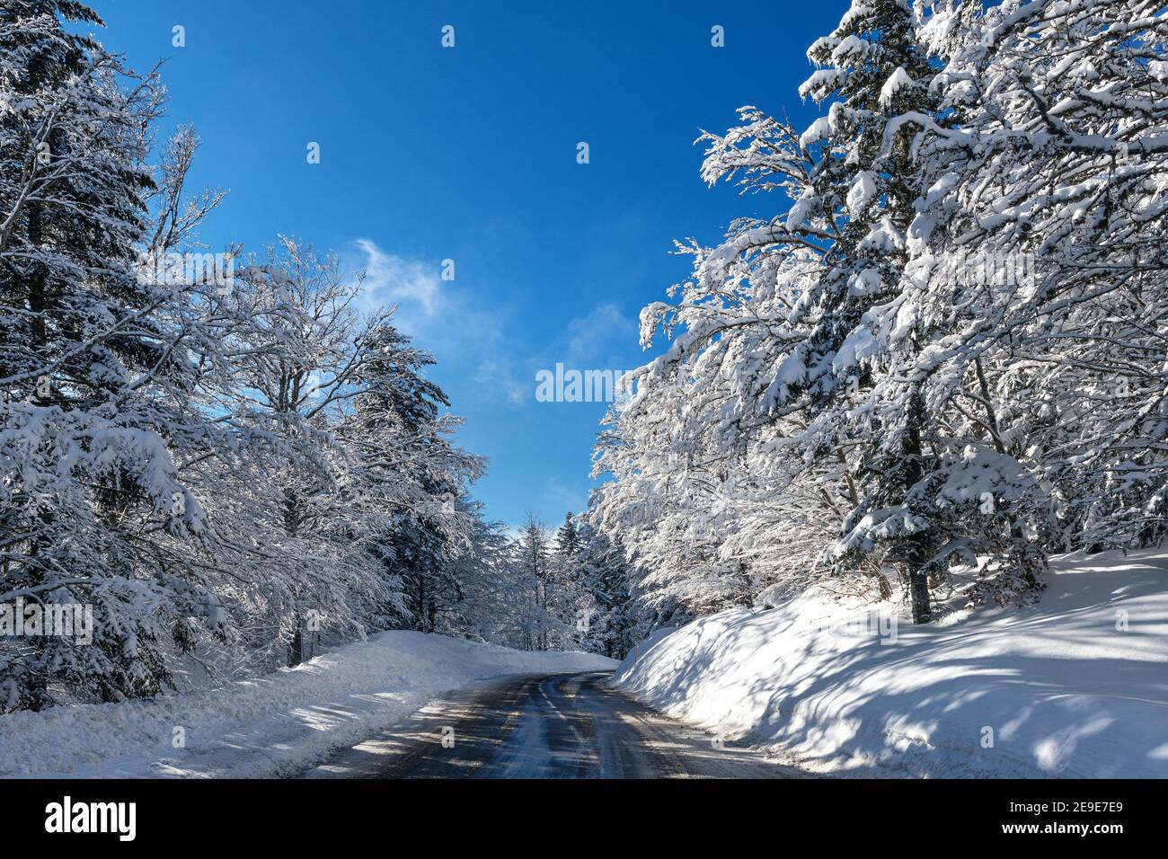 French winter landscapes. Snowy and icy mountain road. Vercors Regional Natural Park. Stock Photo