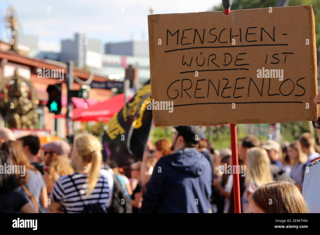 Protest for the refugees in Greece in Hamburg. The sign says in German: 'human dignity is limitless' Stock Photo
