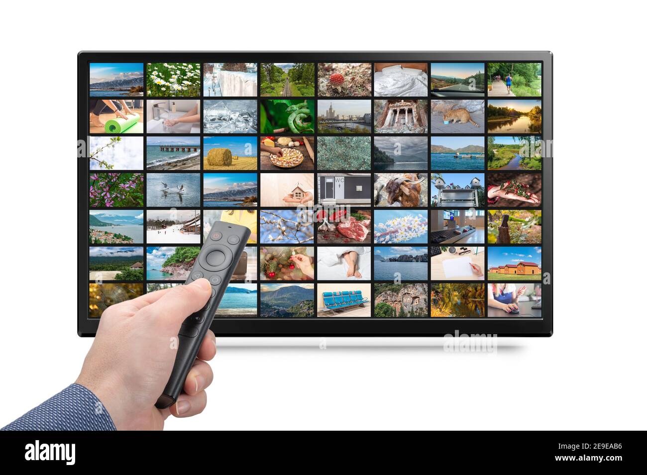 Online TV, Streaming VOD service concept. Male hand holding TV remote control. Television streaming video