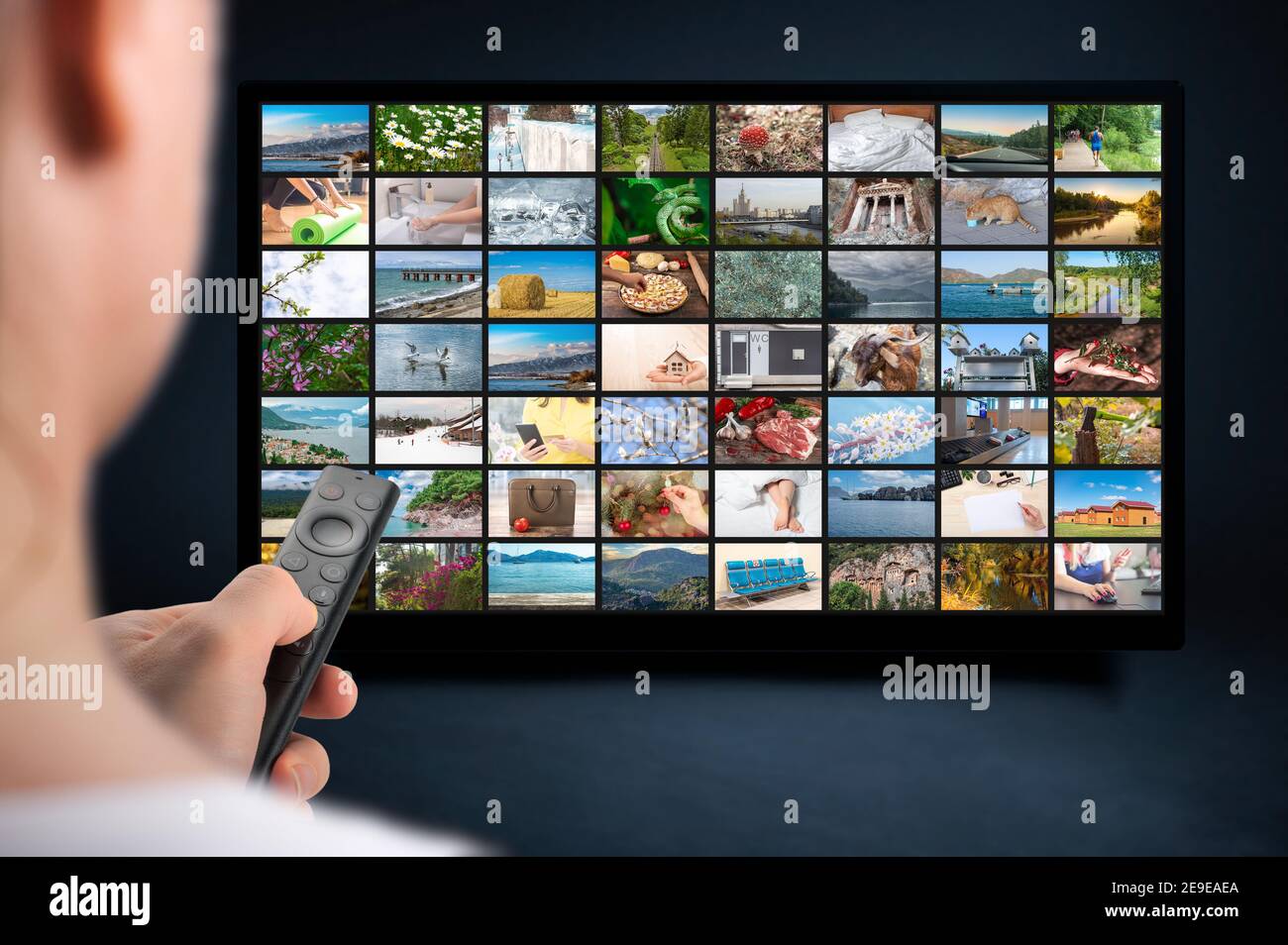 Person holds remote control. VoD content provider concept. Television streaming video concept