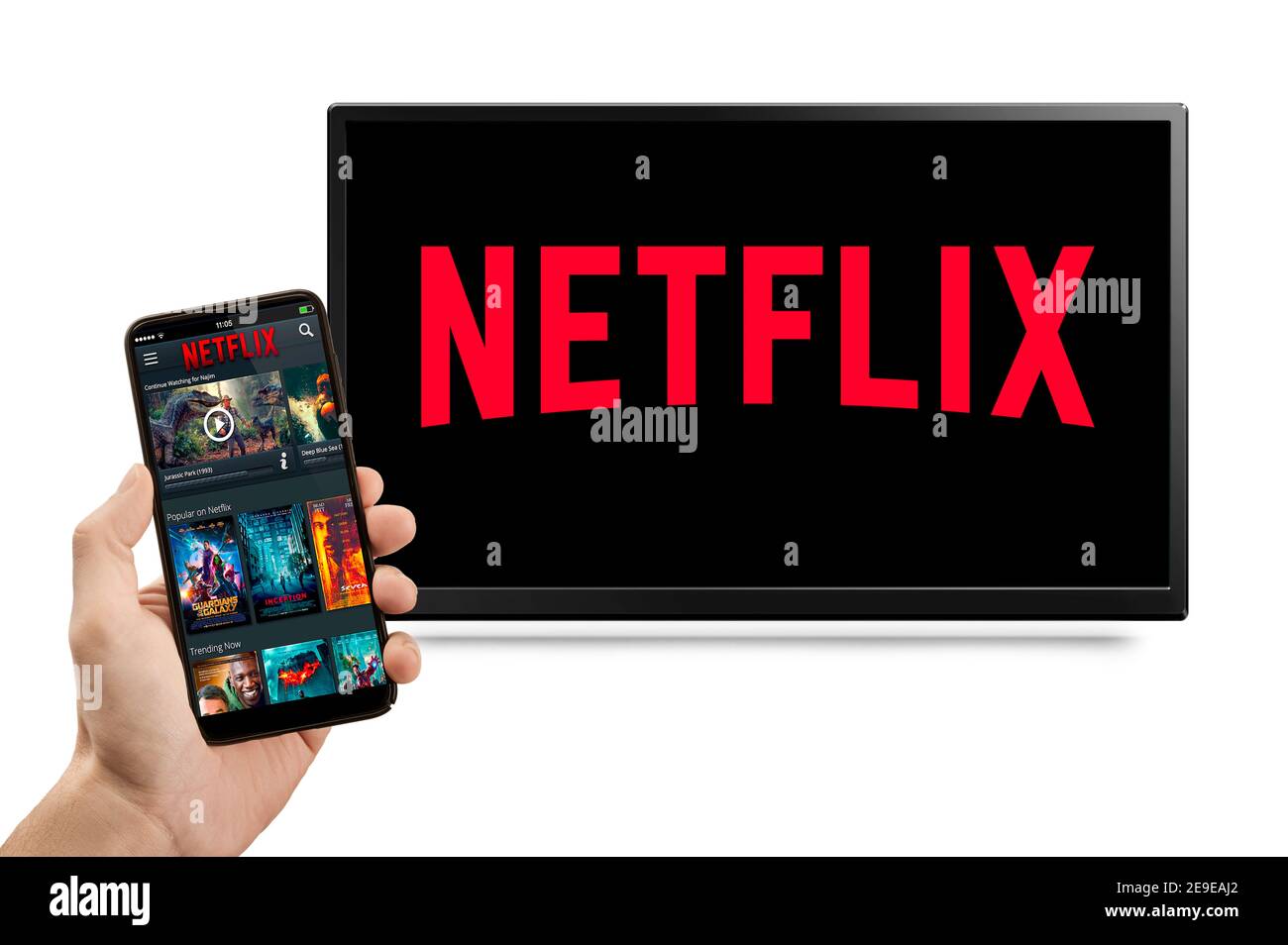 USA, NEW YORK February 2, 2021: NETFLIX Interface of video distribution service on screen phone and TV Screen with Netflix Logo, Netflix is a well kno Stock Photo