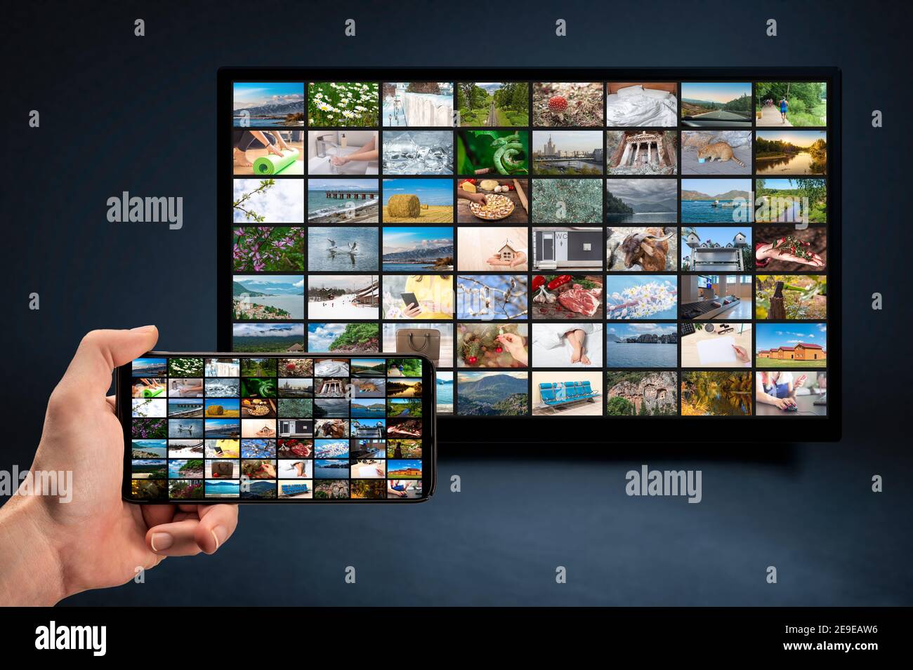man holding mobile phone with many icons of video service on demand on background Oline TV VOD provider