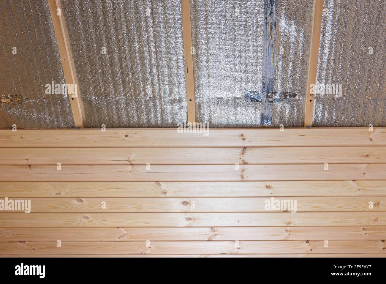 Decorating the ceiling of the room with clapboard, the ceiling is